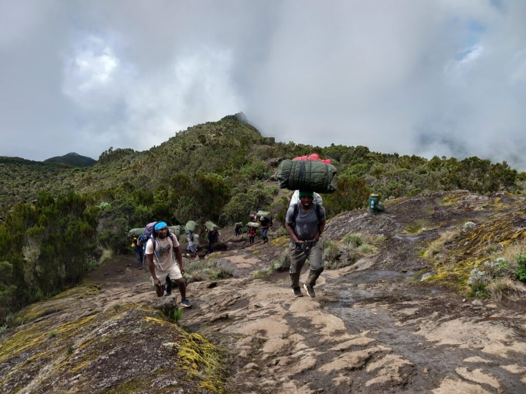 Kilimanjaro Trekking: Duncan with a porter
